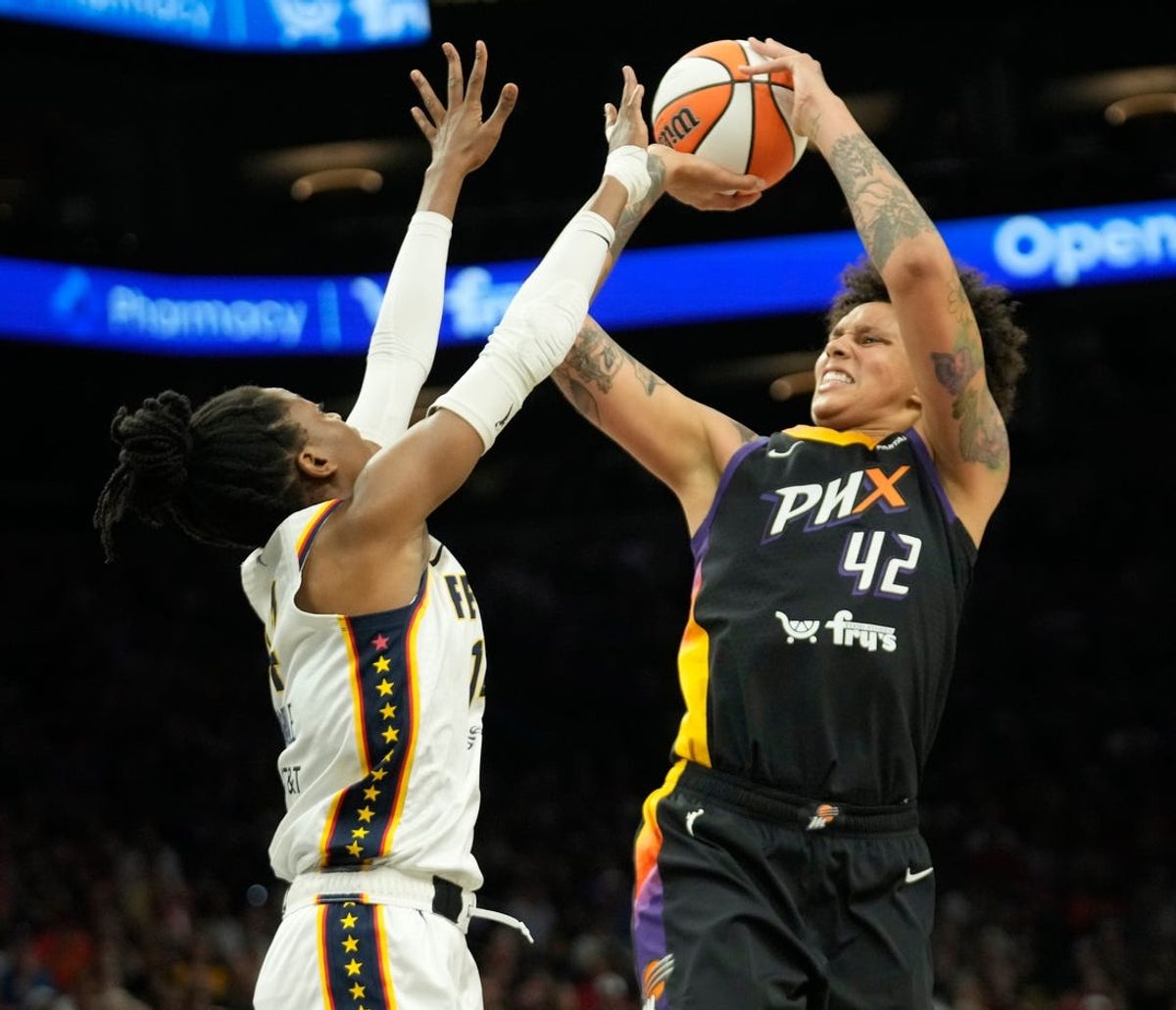 Phoenix Mercury center Brittney Griner (42) shoots over Indiana Fever center Temi Fagbenle (14) during the first quarter at Footprint Center on June 30, 2024, in Phoenix.