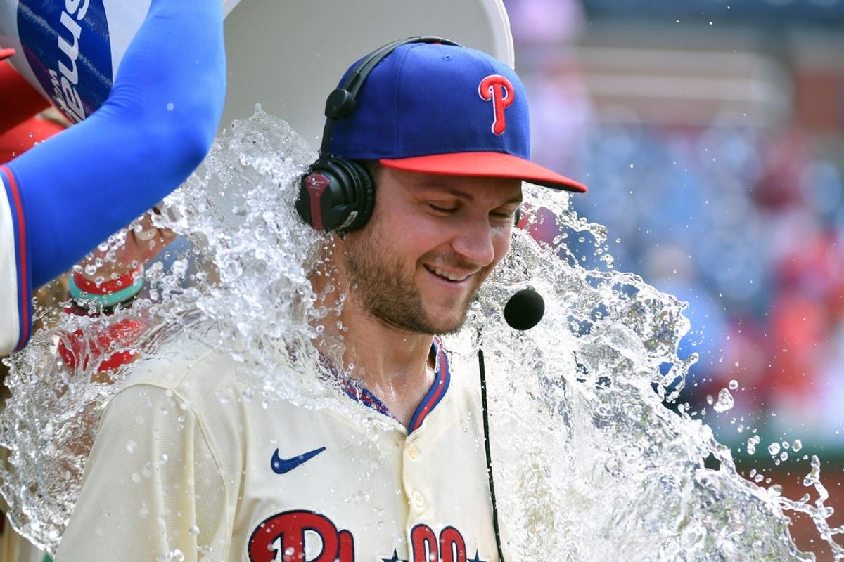Jun 30, 2024; Philadelphia, Pennsylvania, USA; Philadelphia Phillies shortstop Trea Turner (7) had water dumped on him after win against the Miami Marlins at Citizens Bank Park. Mandatory Credit: Eric Hartline-USA TODAY Sports