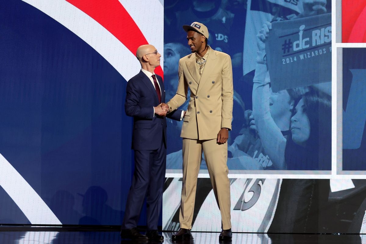 Jun 26, 2024; Brooklyn, NY, USA; Alexandre Sarr shakes hands with NBA commissioner Adam Silver after being selected second overall by the Washington Wizards in the first round in the 2024 NBA Draft at Barclays Center. Mandatory Credit: Brad Penner-USA TODAY Sports