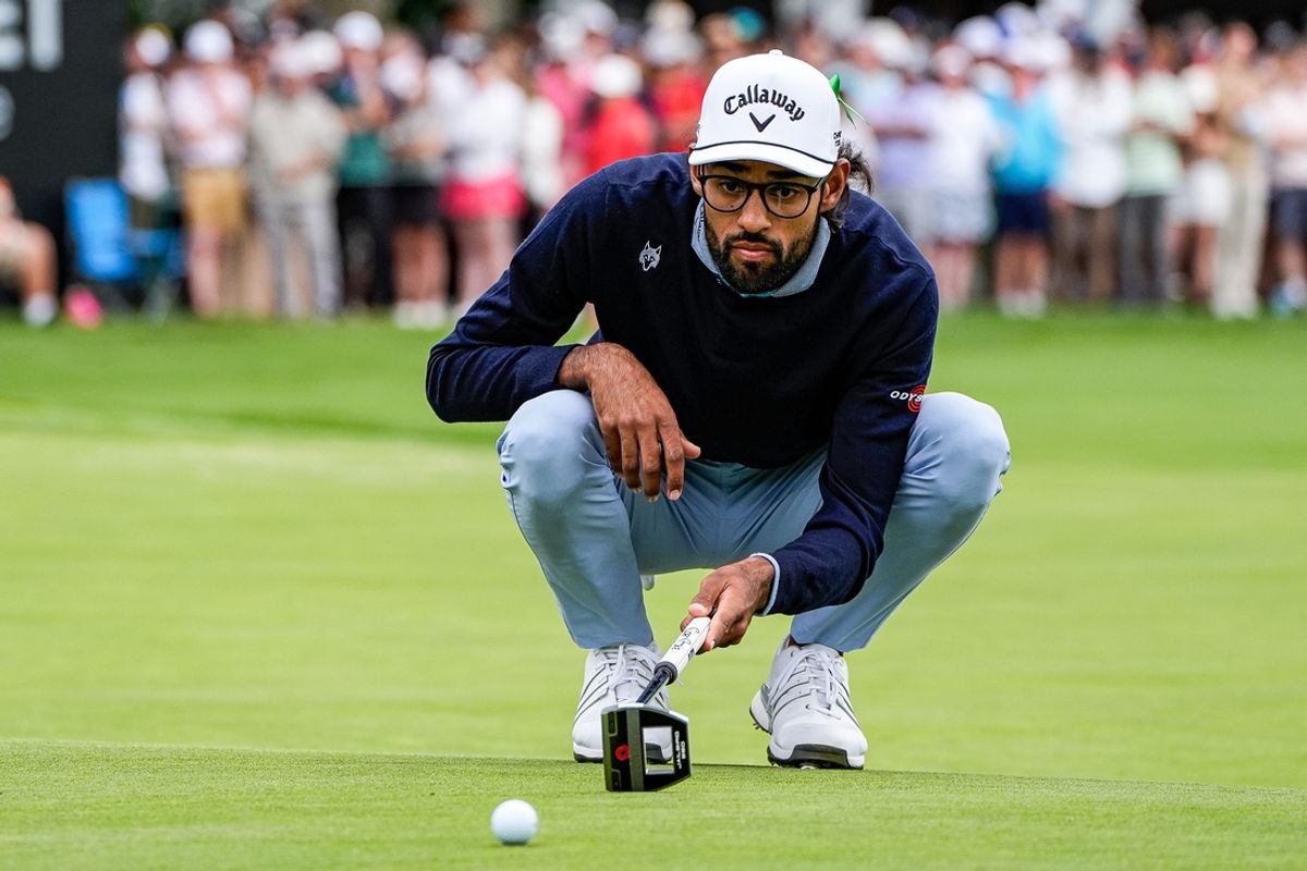 Akshay Bhatia lines up a shot on the 14th green during final round of Rocket Mortgage Classic at Detroit Golf Club in Detroit on Sunday, June 30, 2024.