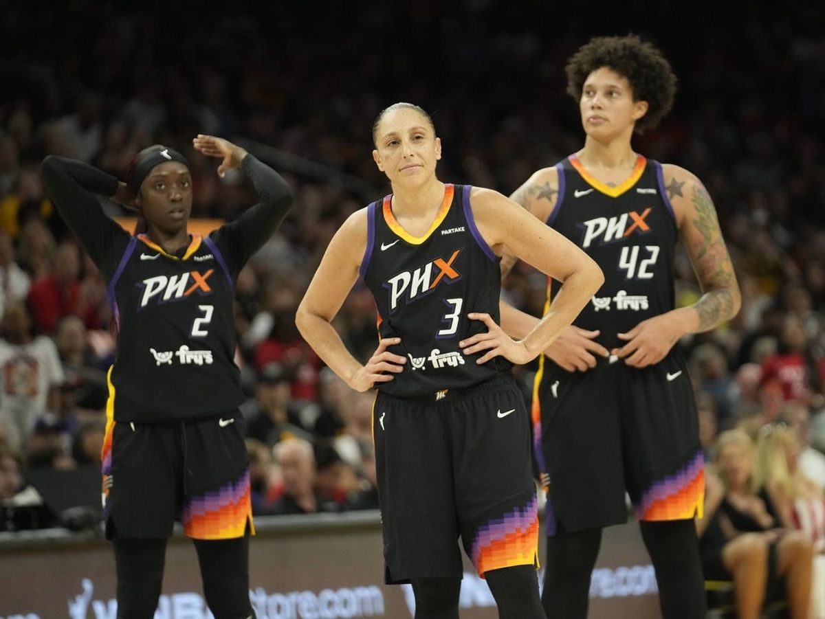 Jun 30, 2024; Phoenix, Ariz., U.S.; Phoenix Mercury guards Kahleah Copper (2) and Diana Taurasi (3) and center Brittney Griner (42) wait for free throws during the fourth quarter against the Indiana Fever at Footprint Center. Mandatory Credit: Michael Chow-Arizona Republic