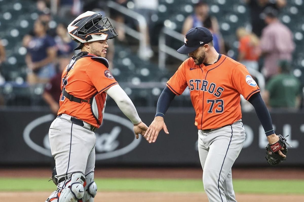 Jun 30, 2024; New York City, New York, USA;  Houston Astros catcher Yainer Diaz (21) and relief pitcher Luis Contreras (73) celebrate after defeating the New York Mets 10-5 at Citi Field. Mandatory Credit: Wendell Cruz-USA TODAY Sports