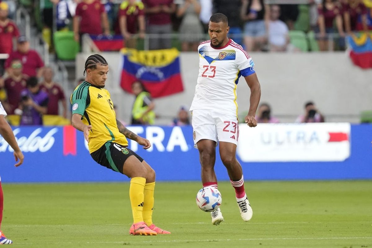 Jun 30, 2024; Austin, TX, USA; Venezuela goalkeeper forward Salomón Rondón (23) dribbles while defended by Jamaica midfielder Joel Latibeaudiere (15) during the first half at Q2 Stadium. Mandatory Credit: Scott Wachter-USA TODAY Sports