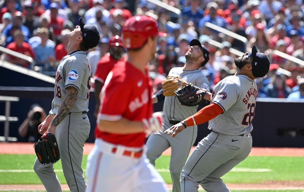 Jul 1, 2024; Toronto, Ontario, CAN;   Houston Astros first baseman Jon Singleton (28) and third baseman Alex Bregman (2) and pitcher Hunter Brown (58) gather under a pop up hit by Toronto Blue Jays third baseman Ernie Clement (28, foreground) in the second inning at Rogers Centre. Mandatory Credit: Dan Hamilton-USA TODAY Sports