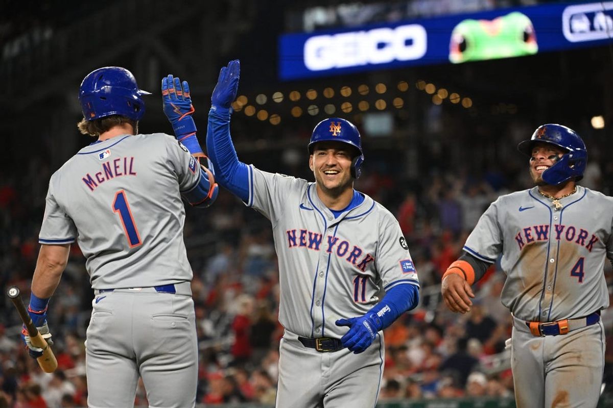 Jul 1, 2024; Washington, District of Columbia, USA; New York Mets second baseman Jose Iglesias (11) celebrates with second baseman Jeff McNeil (1) after hitting a home run against the Washington Nationals during the tenth inning at Nationals Park. Mandatory Credit: Rafael Suanes-USA TODAY Sports