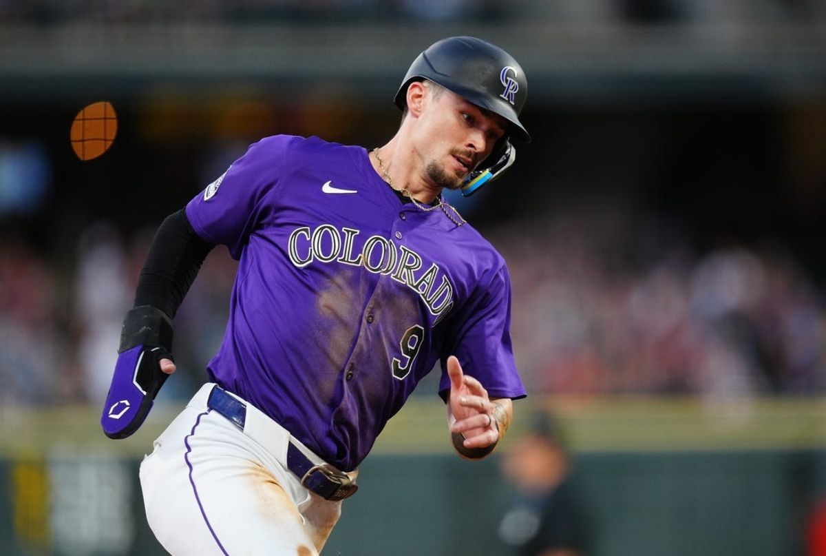Jul 1, 2024; Denver, Colorado, USA; Colorado Rockies outfielder Brenton Doyle (9) heads home to score a run during the sixth inning against the Milwaukee Brewers at Coors Field. Mandatory Credit: Ron Chenoy-USA TODAY Sports