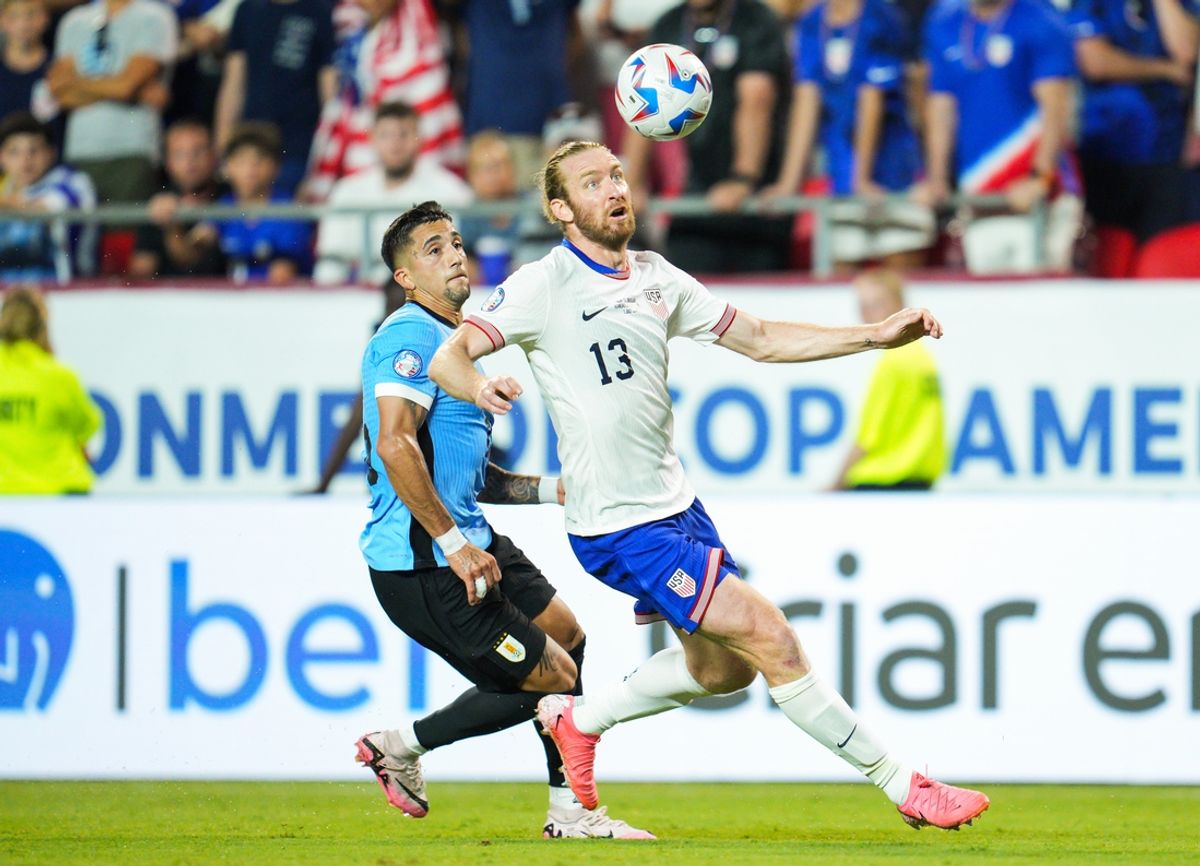 Jul 1, 2024; Kansas City, Missouri, USA; United States defender Tim Ream (13) and Uruguay forward Cristian Olivera (25) fight for the ball during the second half of a Copa America match at Arrowhead Stadium. Mandatory Credit: Jay Biggerstaff-USA TODAY Sports