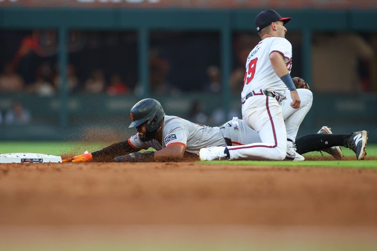 Jul 2, 2024; Atlanta, Georgia, USA; San Francisco Giants center fielder Heliot Ramos (17) steals second base against the Atlanta Braves in the third inning at Truist Park. Mandatory Credit: Brett Davis-USA TODAY Sports
