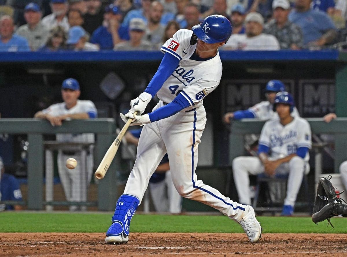 Jul 2, 2024; Kansas City, Missouri, USA;  Kansas City Royals third baseman CJ Alexander (40) singles for his first Major League hit in the fifth inning against the Tampa Bay Rays at Kauffman Stadium. Mandatory Credit: Peter Aiken-USA TODAY Sports