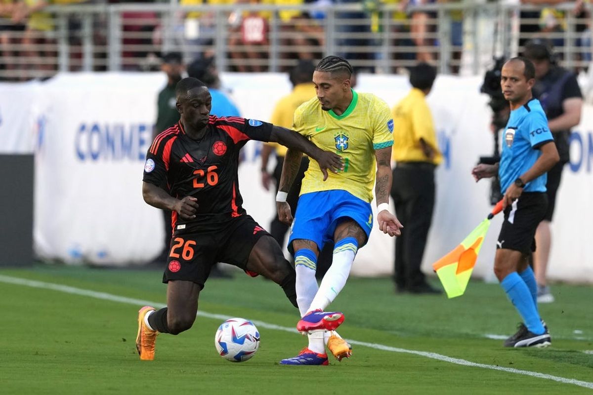 Jul 2, 2024; Santa Clara, CA, USA; Brazil midfielder Raphinha (center right) passes against Colombia defender Deiver Machado (26) during the first half at Levi's Stadium. Mandatory Credit: Darren Yamashita-USA TODAY Sports