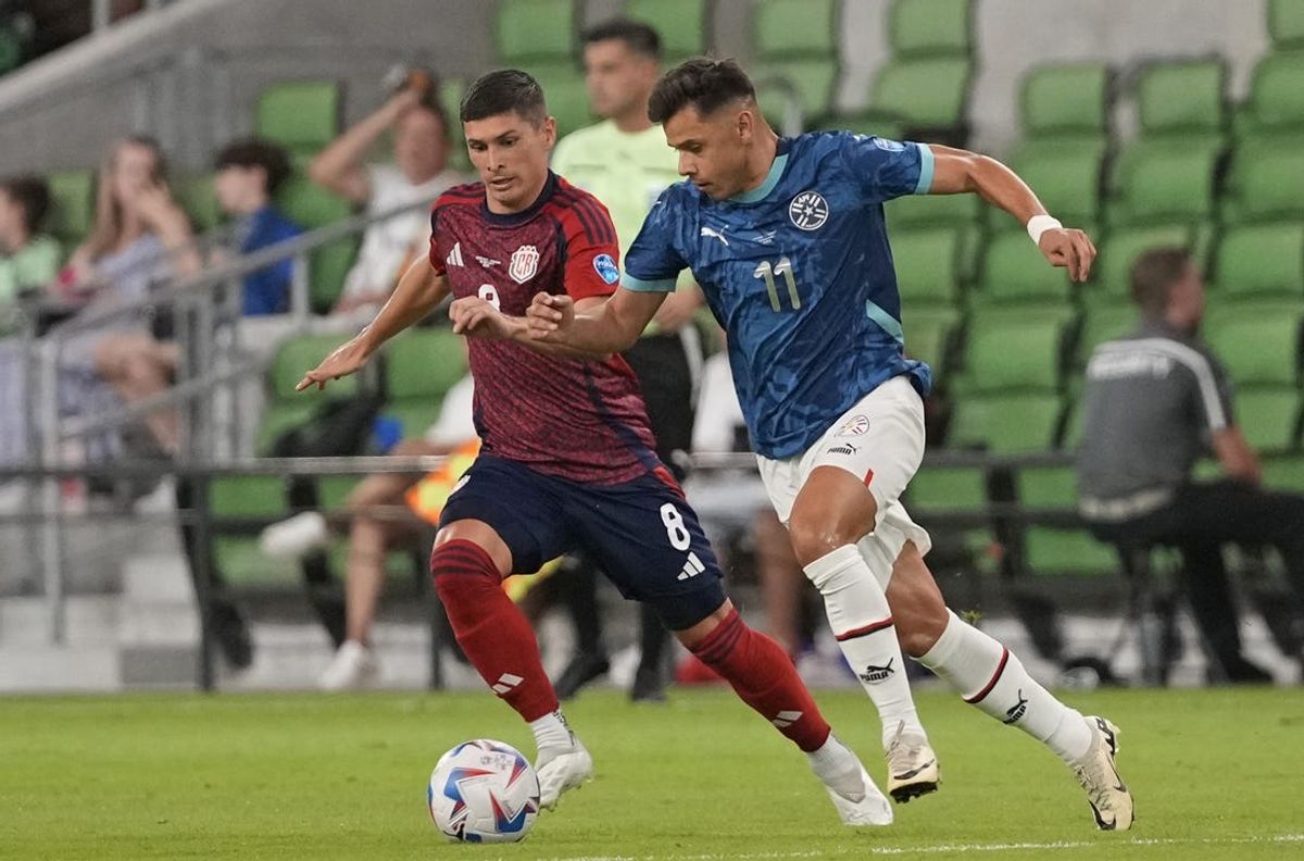 Jul 2, 2024; Austin, TX, USA; Paraguay forward Ángel Romero (11) and Costa Rica defender Joseph Mora (8) chase the ball during the second half at Q2 Stadium. Mandatory Credit: Scott Wachter-USA TODAY Sports