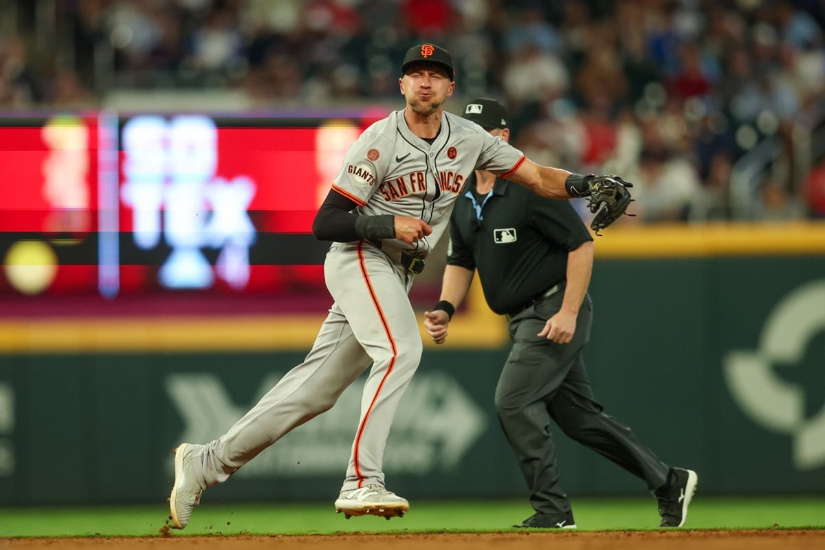 Jul 2, 2024; Atlanta, Georgia, USA; San Francisco Giants shortstop Nick Ahmed (16) throws a runner out at first against the Atlanta Braves in the sixth inning at Truist Park. Mandatory Credit: Brett Davis-USA TODAY Sports