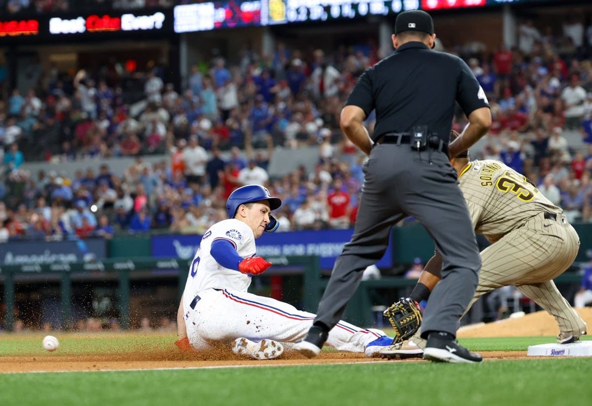 Jul 2, 2024; Arlington, Texas, USA;  Texas Rangers left fielder Wyatt Langford (36) advances to third base after a double during the fifth inning against the San Diego Padres at Globe Life Field. Mandatory Credit: Kevin Jairaj-USA TODAY Sports