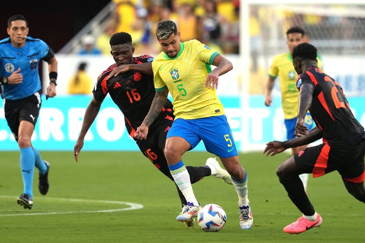 Jul 2, 2024; Santa Clara, CA, USA; Brazil midfielder Bruno Guimaraes (5) dribbles against Colombia midfielder Jefferson Lerma (16) and defender Davinson Sanchez (right) during the second half at Levi's Stadium. Mandatory Credit: Darren Yamashita-Imagn Images