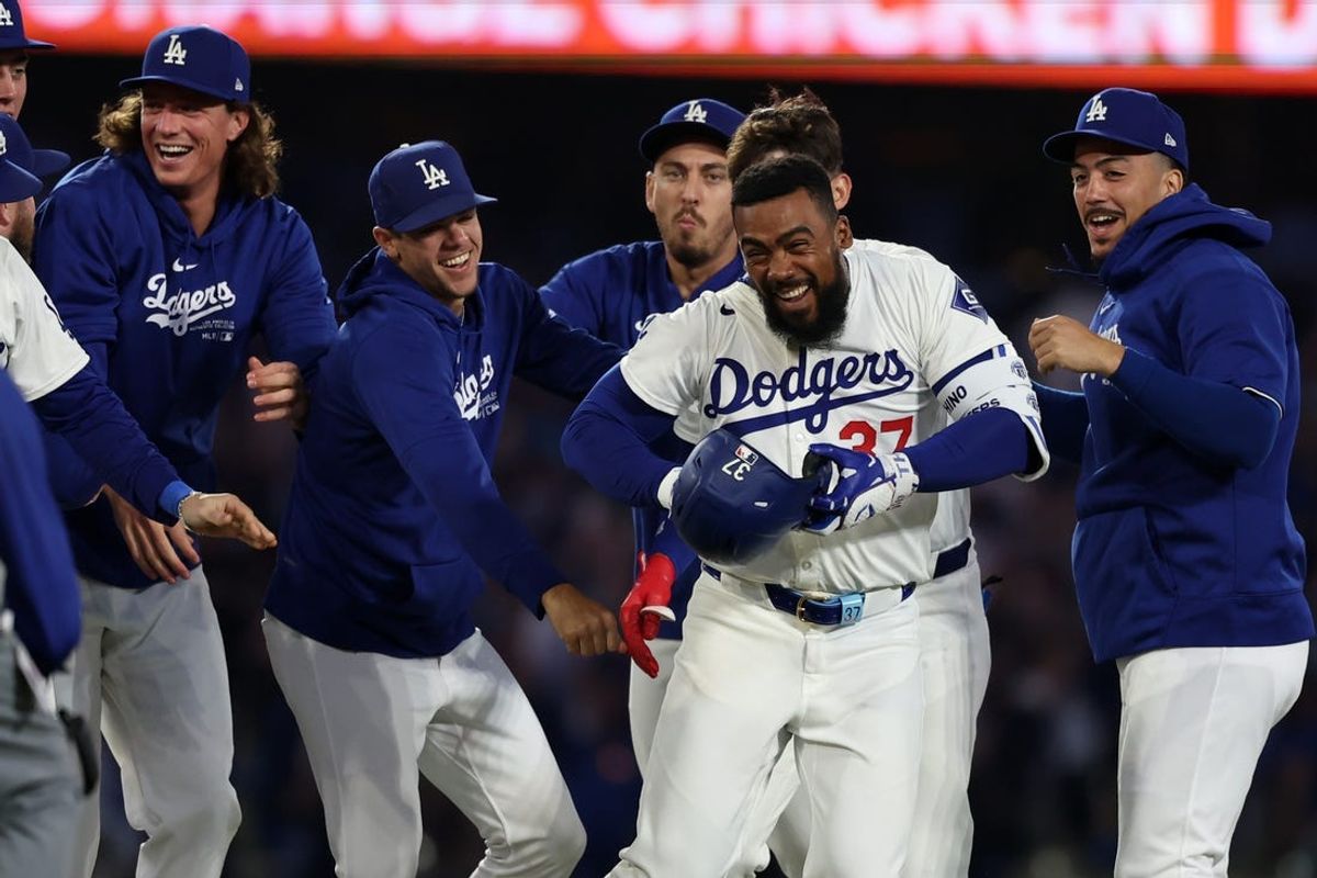 Jul 2, 2024; Los Angeles, California, USA;  Los Angeles Dodgers left fielder Teoscar Hernandez (37) celebrates with teammates after hitting a walk off hit to defeat the Arizona Diamondbacks in bottom of the ninth inning at Dodger Stadium. Mandatory Credit: Kiyoshi Mio-USA TODAY Sports