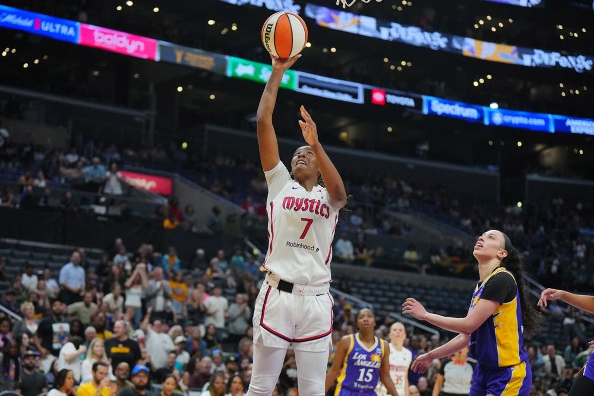 Jul 2, 2024; Los Angeles, California, USA; Washington Mystics guard Ariel Atkins (7) shoots the ball against LA Sparks forward Dearica Hamby (5) in the second half at Crypto.com Arena. Mandatory Credit: Kirby Lee-USA TODAY Sports