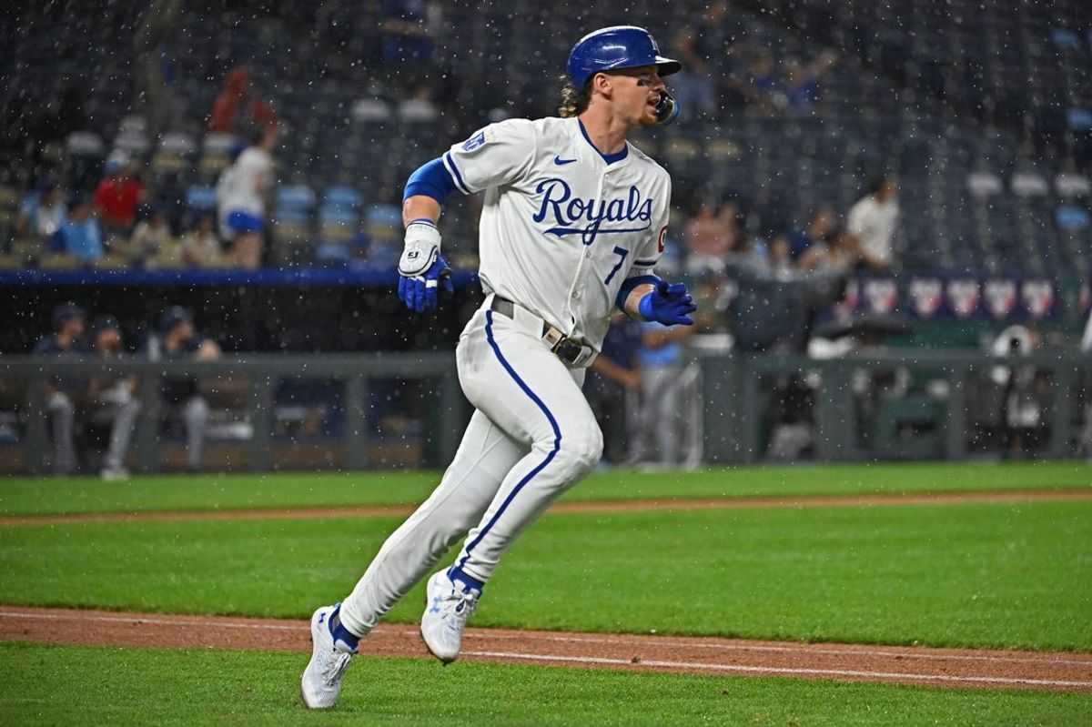 Jul 2, 2024; Kansas City, Missouri, USA; Kansas City Royals shortstop Bobby Witt Jr. (7) hits a solo home run in the sixth inning against the Tampa Bay Rays at Kauffman Stadium. Mandatory Credit: Peter Aiken-USA TODAY Sports