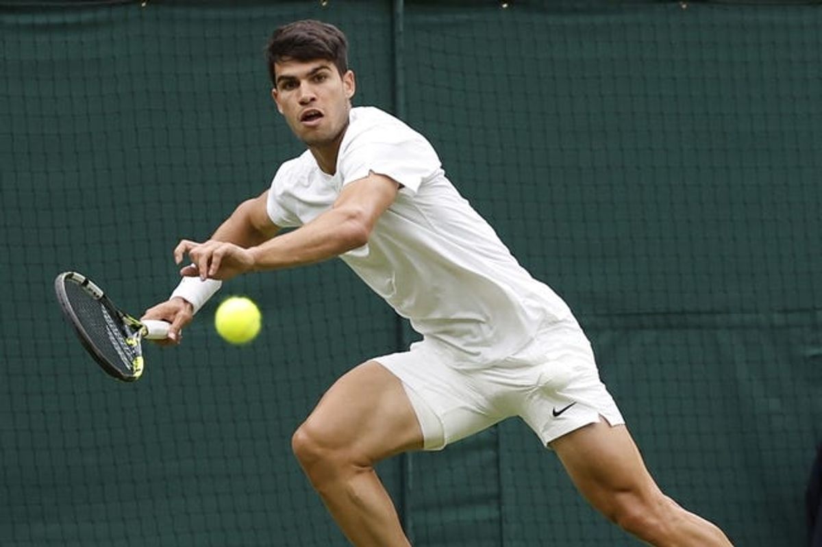 Jul 3, 2024; London, United Kingdom; Carlos Alcaraz (ESP) prepares to hit a forehand against Aleksandar Vukic (AUS)(not pictured) in a gentlemen's singles match on day three of The Championships Wimbledon 2024 at All England Lawn Tennis and Croquet Club. Mandatory Credit: Geoff Burke-USA TODAY Sports