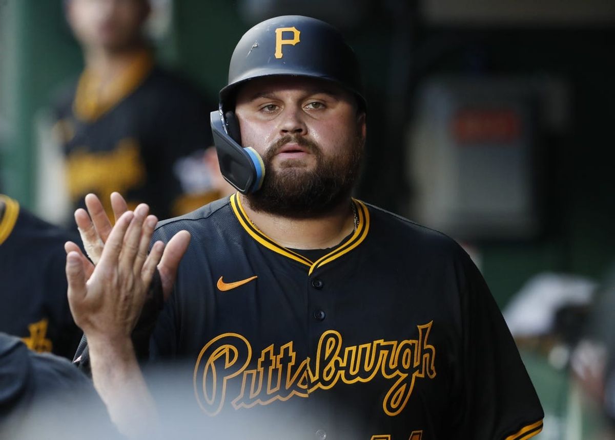 Jul 3, 2024; Pittsburgh, Pennsylvania, USA;  Pittsburgh Pirates first baseman Rowdy Tellez (44) high-fives in the dugout after scoring a run against the St. Louis Cardinals during the fifth inning at PNC Park. Mandatory Credit: Charles LeClaire-USA TODAY Sports