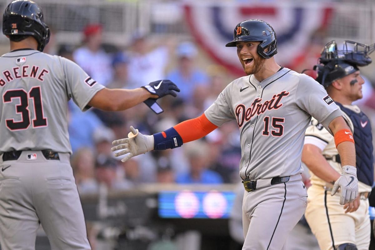 Jul 3, 2024; Minneapolis, Minnesota, USA; Detroit Tigers catcher Carson Kelly (15) celebrates his grand slam against the Minnesota Twins with outfielder Riley Greene (31) during the third inning at Target Field. Mandatory Credit: Nick Wosika-USA TODAY Sports
