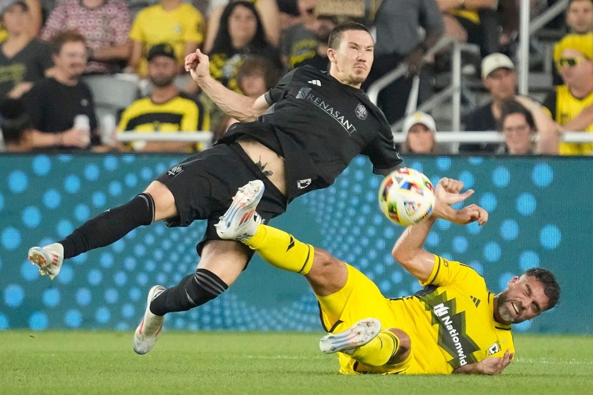 Jul 3, 2024; Columbus, OH, USA; Columbus Crew defender Rudy Camacho (4) collides with Nashville SC midfielder Alex Muyl (19) during the first half of the MLS soccer game at Lower.com Field. Mandatory Credit: Adam Cairns-The Columbus Dispatch