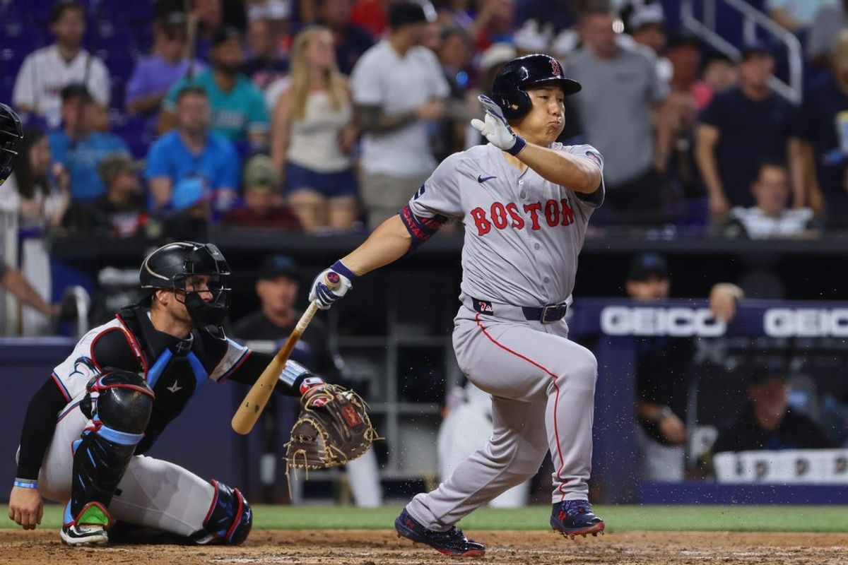 Jul 3, 2024; Miami, Florida, USA; Boston Red Sox left fielder Masataka Yoshida (7) hits an RBI single against the Miami Marlins during the third inning at loanDepot Park. Mandatory Credit: Sam Navarro-USA TODAY Sports