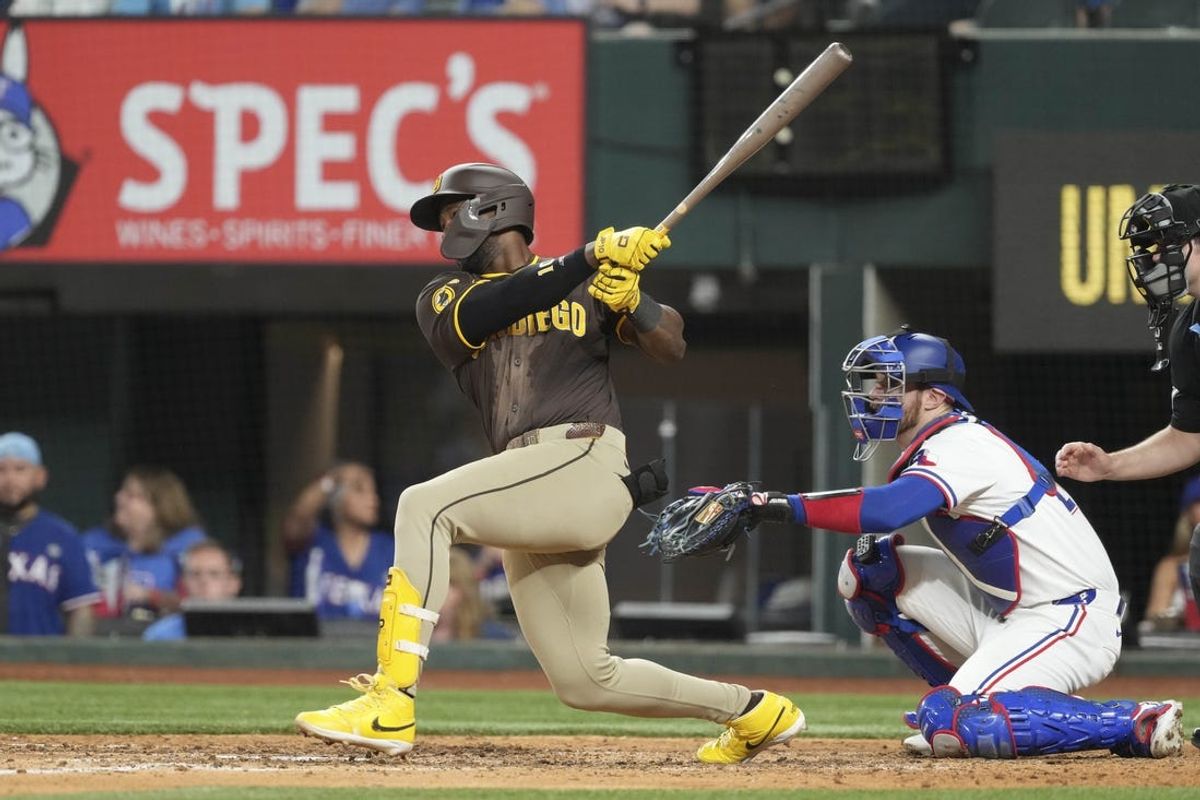 Jul 3, 2024; Arlington, Texas, USA; San Diego Padres left fielder Jurickson Profar (10) follows through on his single against the Texas Rangers during the sixth inning at Globe Life Field. Mandatory Credit: Jim Cowsert-USA TODAY Sports