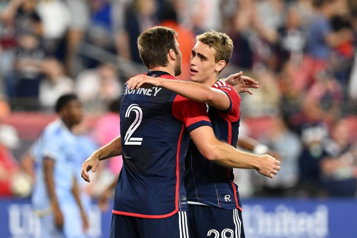 Jul 3, 2024; Foxborough, Massachusetts, USA; New England Revolution defender Dave Romney (2) hugs midfielder Noel Buck (29) after a game against the Atlanta United at Gillette Stadium. Mandatory Credit: Brian Fluharty-USA TODAY Sports