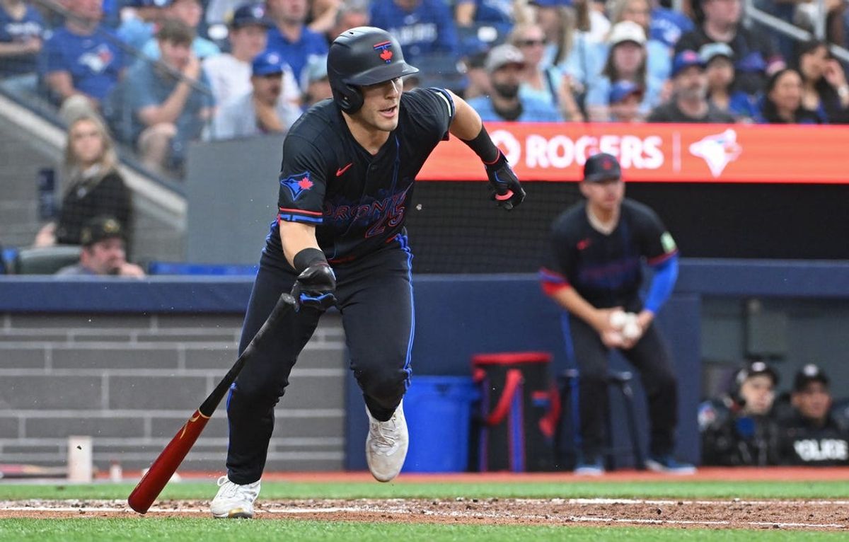 Jul 3, 2024; Toronto, Ontario, CAN; Toronto Blue Jays centre fielder Daulton Varsho (25) hits a double in the fourth inning against the Houston Astros at Rogers Centre. Mandatory Credit: Gerry Angus-USA TODAY Sports