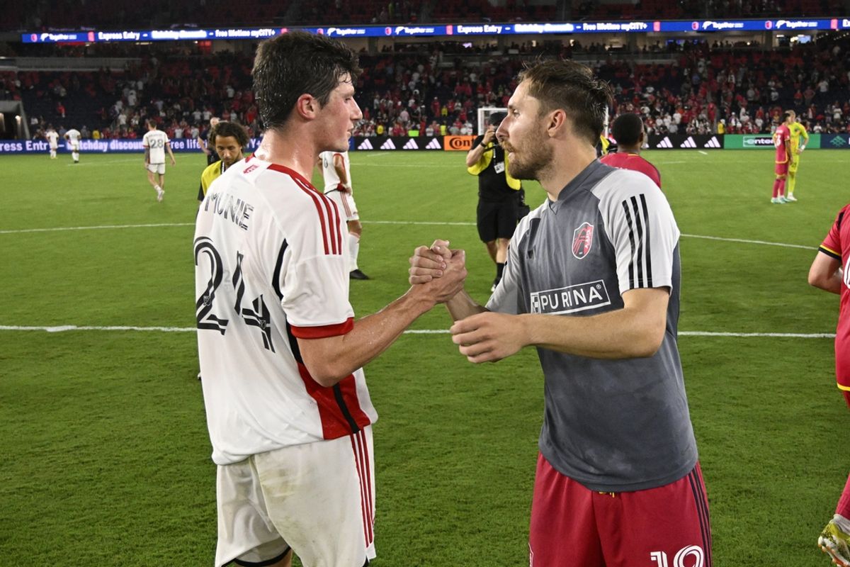 Jul 3, 2024; St. Louis, Missouri, USA; St. Louis CITY SC midfielder Indiana Vassilev (19) shakes hands with San Jose Earthquakes defender Daniel Munie (24) after St. Louis CITY SC wins 2-0 at CITYPARK. Mandatory Credit: Joe Puetz-Imagn Images