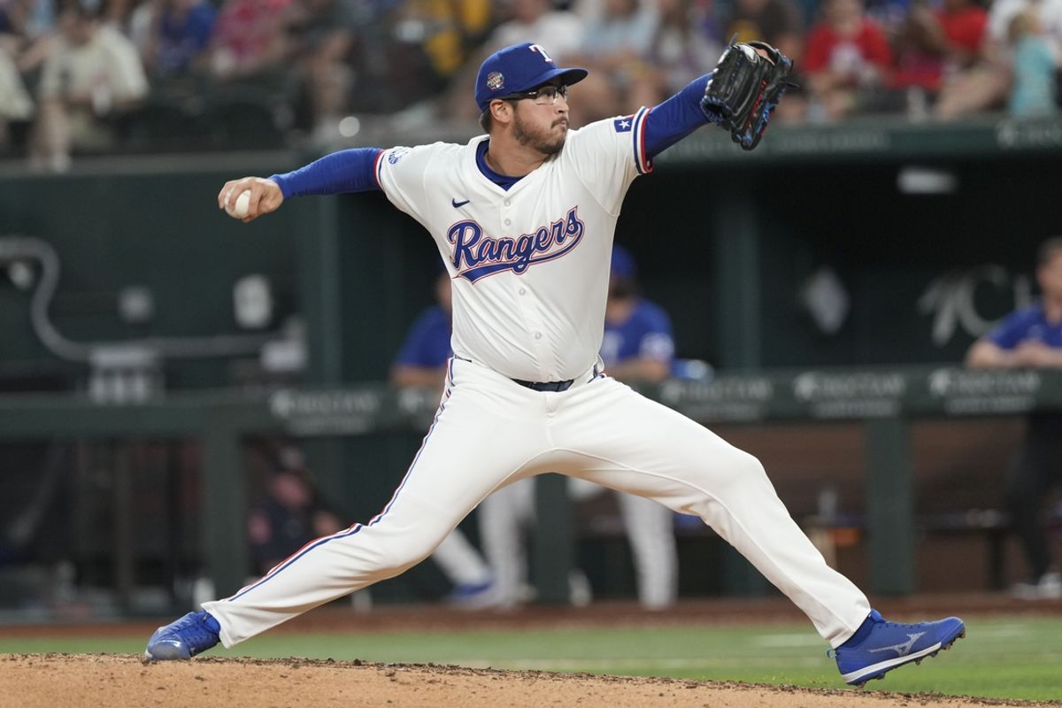 Jul 3, 2024; Arlington, Texas, USA; Texas Rangers starting pitcher Dane Dunning (33) delivers a pitch to the San Diego Padres during the seventh inning at Globe Life Field. Mandatory Credit: Jim Cowsert-USA TODAY Sports