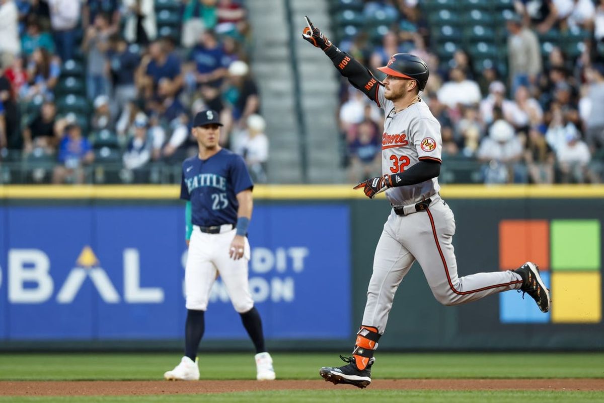 Jul 3, 2024; Seattle, Washington, USA; Baltimore Orioles first baseman Ryan O'Hearn (32) reacts towards the Orioles bullpen after hitting a solo-home run against the Seattle Mariners during the fifth inning at T-Mobile Park. Mandatory Credit: Joe Nicholson-USA TODAY Sports