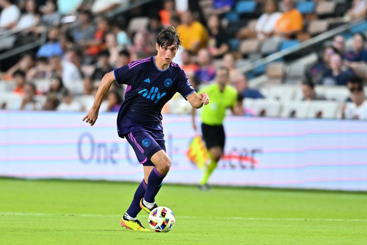 Jun 29, 2024; Houston, Texas, USA; Charlotte FC midfielder Ben Bender (15) dribbles the ball during the first half against Houston Dynamo FC at Shell Enegry Stadium. Mandatory Credit: Maria Lysaker-Imagn Images