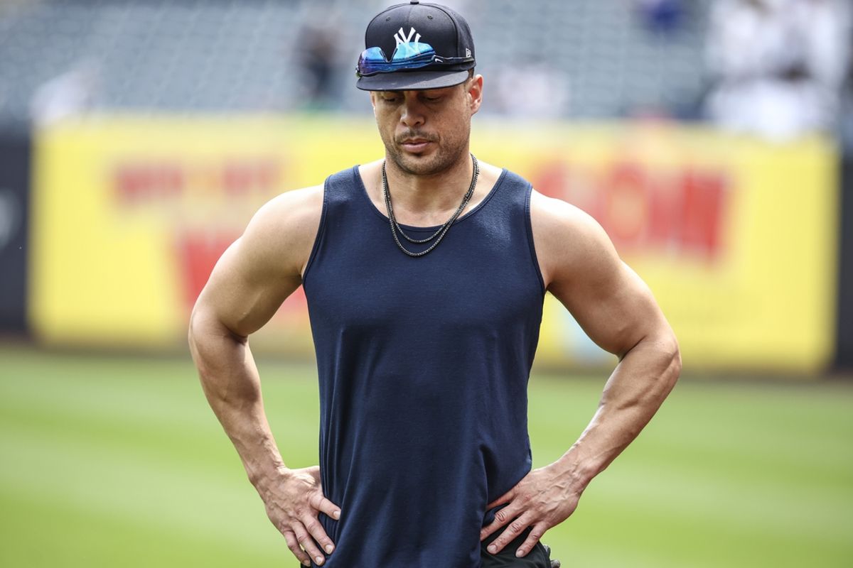 Jul 4, 2024; Bronx, New York, USA; New York Yankees outfielder and designated hitter Giancarlo Stanton (27) works out prior to the game against the Cincinnati Reds at Yankee Stadium. Mandatory Credit: Wendell Cruz-USA TODAY Sports