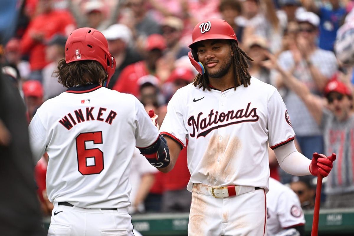 Jul 4, 2024; Washington, District of Columbia, USA; Washington Nationals left fielder Jesse Winker (6) celebrates with center fielder James Wood (50) after hitting a home run against the New York Mets during the eighth inning at Nationals Park. Mandatory Credit: Rafael Suanes-USA TODAY Sports