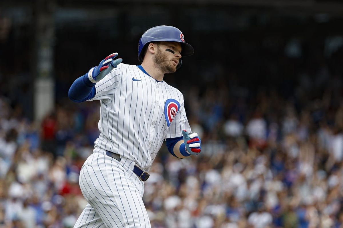 Jul 4, 2024; Chicago, Illinois, USA; Chicago Cubs outfielder Ian Happ (8) rounds the bases after hitting a three-run home run against the Philadelphia Phillies during the fourth inning at Wrigley Field. Mandatory Credit: Kamil Krzaczynski-USA TODAY Sports