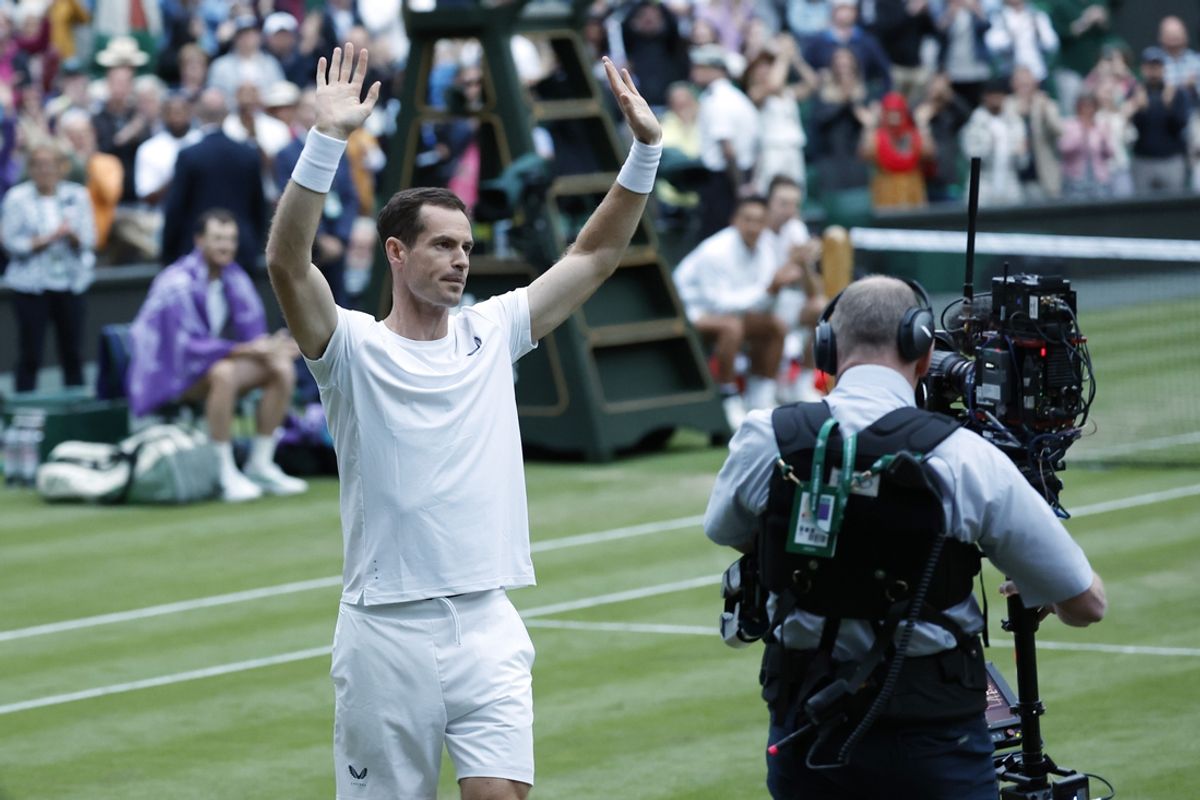 Jul 4, 2024; London, United Kingdom; Andy Murray (GBR) waves to the crowd at the conclusion of a ceremony honoring his Wimbledon career after participating in a gentlemen's doubles match with brother Jamie Murray (M)(GBR) against Rinky Hijikata and John Peers (AUS)(both not pictured) on day four of The Championships Wimbledon 2024 at All England Lawn Tennis and Croquet Club. Mandatory Credit: Geoff Burke-USA TODAY Sports