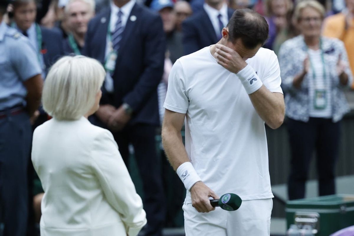 Jul 4, 2024; London, United Kingdom; Andy Murray (GBR) becomes emotional during a ceremony honoring his Wimbledon career emceed by former BBC presenter Sue Barker (L) after participating in a gentlemen's doubles match with brother Jamie Murray (not pictured)(GBR) against Rinky Hijikata (AUS) and John Peers (AUS)(both not pictured) on day four of The Championships Wimbledon 2024 at All England Lawn Tennis and Croquet Club. Mandatory Credit: Geoff Burke-USA TODAY Sports