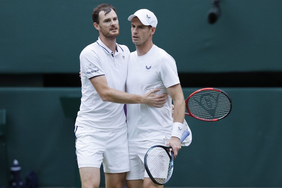 Jul 4, 2024; London, United Kingdom; Andy Murray (GBR) (R) hugs brother Jamie Murray (L)(GBR) after their match against Rinky Hijikata and John Peers (both AUS)(both not pictured) in gentlemen's doubles on day four of The Championships Wimbledon 2024 at All England Lawn Tennis and Croquet Club. Mandatory Credit: Geoff Burke-Imagn Images