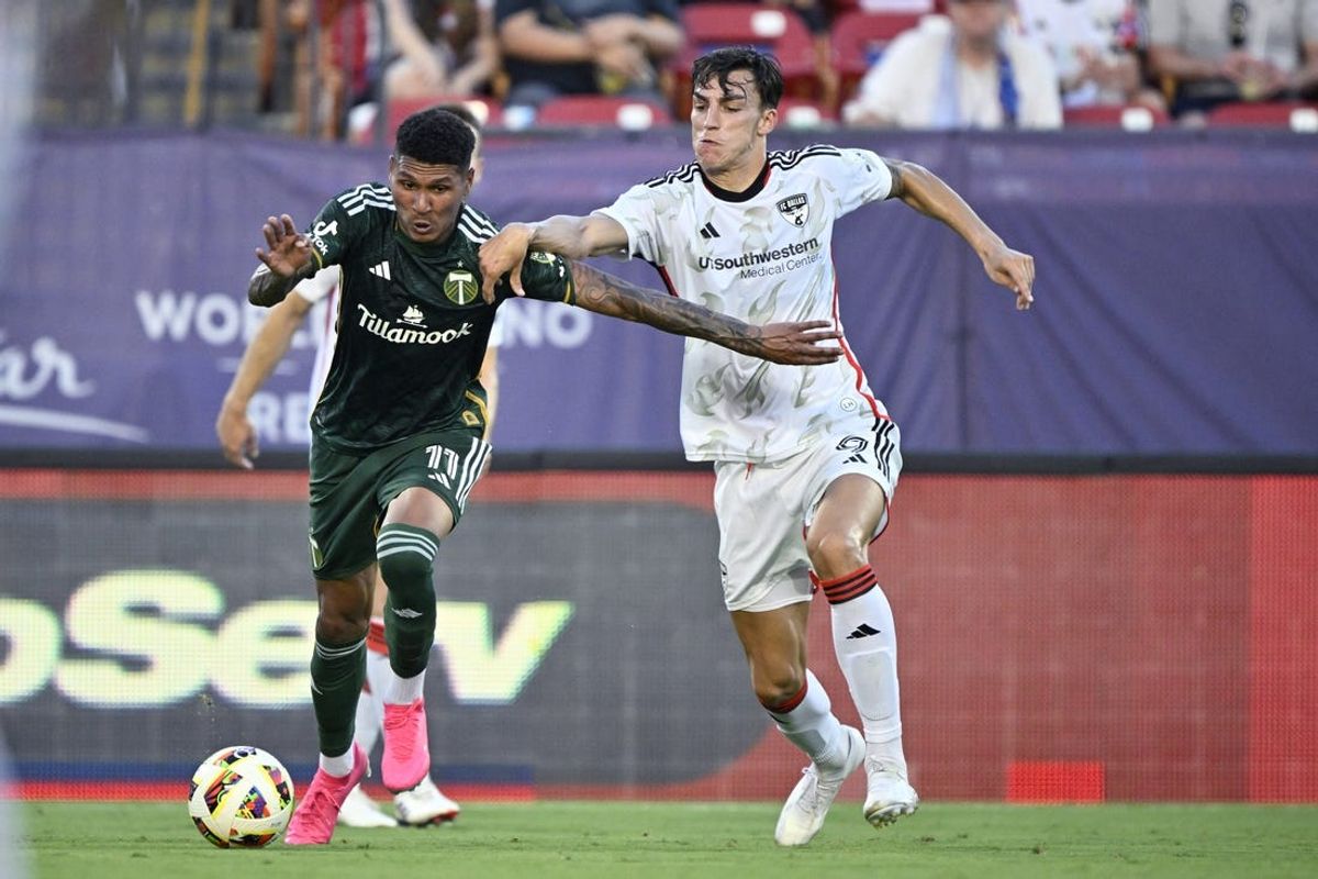 Jul 4, 2024; Frisco, Texas, USA; Portland Timbers forward Antony (11) and FC Dallas forward Petar Musa (9) battle for the ball during the first half at Toyota Stadium. Mandatory Credit: Jerome Miron-USA TODAY Sports