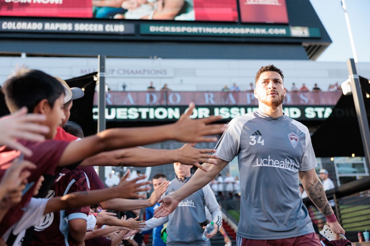 Jul 4, 2024; Commerce City, Colorado, USA; Colorado Rapids defender Michael Edwards (34) high fives fans prior to the game against Sporting Kansas City at Dick's Sporting Goods Park. Mandatory Credit: Andrew Wevers-Imagn Images
