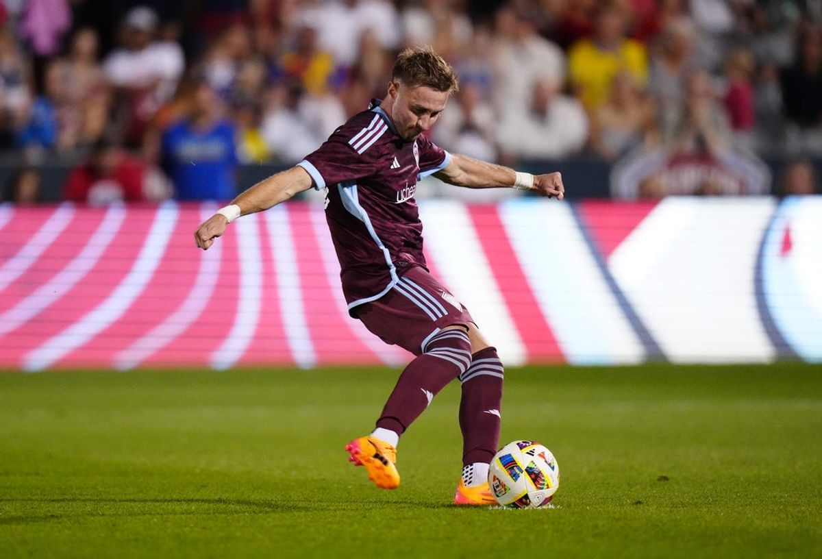 Jul 4, 2024; Commerce City, Colorado, USA; Colorado Rapids midfielder Djordje Mihailovic (10) kicks a successful penalty kick go ahead goal in extra time against Sporting Kansas City at Dick's Sporting Goods Park. Mandatory Credit: Ron Chenoy-USA TODAY Sports