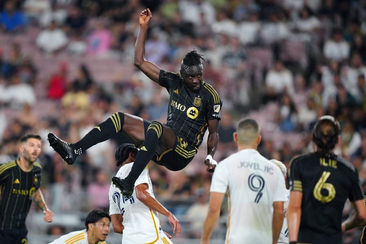 Jul 4, 2024; Pasadena, California, USA; LAFC forward Kei Kamara (23) heads the ball during the first half against the LA Galaxy  at Rose Bowl. Mandatory Credit: Kirby Lee-USA TODAY Sports