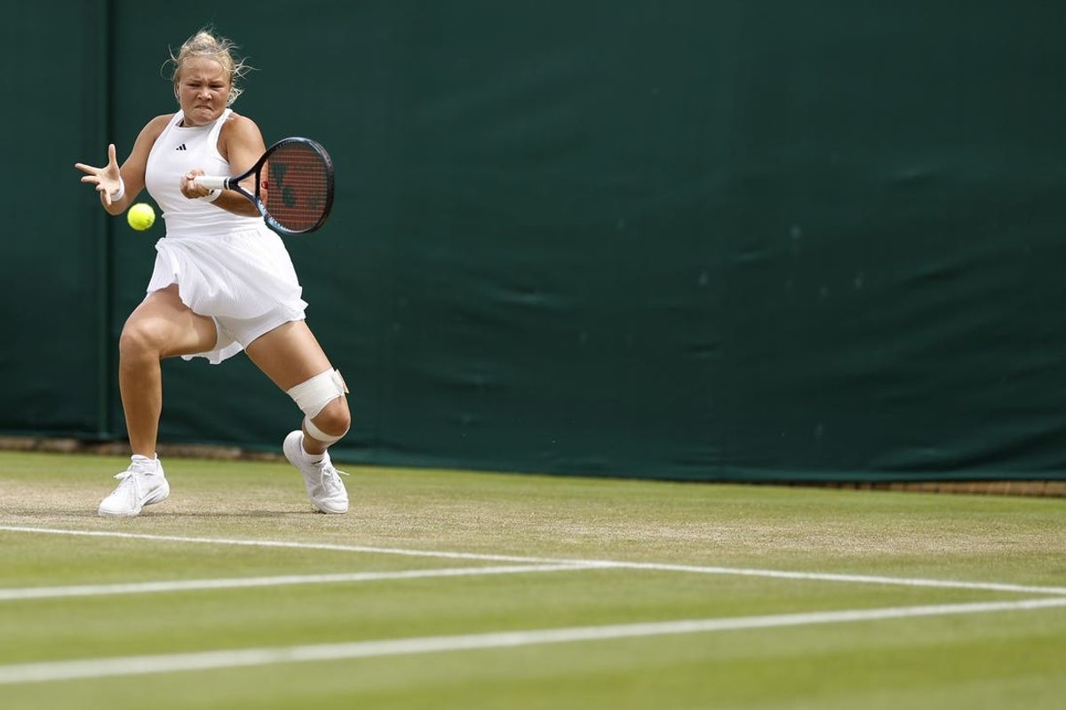 Jul 5, 2024; London,  United Kingdom; Diana Shnaider hits a forehand against Emma Navarro (USA) (not pictured) in a ladies' singles match on day five of The Championships Wimbledon 2024 at All England Lawn Tennis and Croquet Club. Mandatory Credit: Geoff Burke-USA TODAY Sports