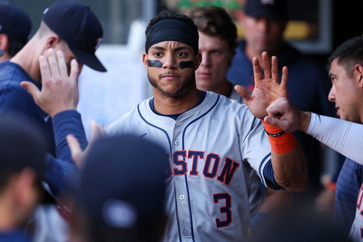 Jul 5, 2024; Minneapolis, Minnesota, USA; Houston Astros shortstop Jeremy Pena (3) celebrates in the dugout after scoring on a single hit by second baseman Jose Altuve (27) during the second inning against the Minnesota Twins at Target Field. Mandatory Credit: Matt Krohn-USA TODAY Sports