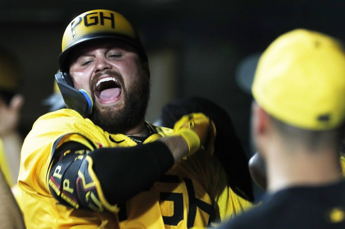 Jul 5, 2024; Pittsburgh, Pennsylvania, USA;  Pittsburgh Pirates first baseman Rowdy Tellez (44) celebrates his grand slam home run in the dugout against the New York Mets during the eighth inning at PNC Park. The Pirates won 14-2. Mandatory Credit: Charles LeClaire-USA TODAY Sports