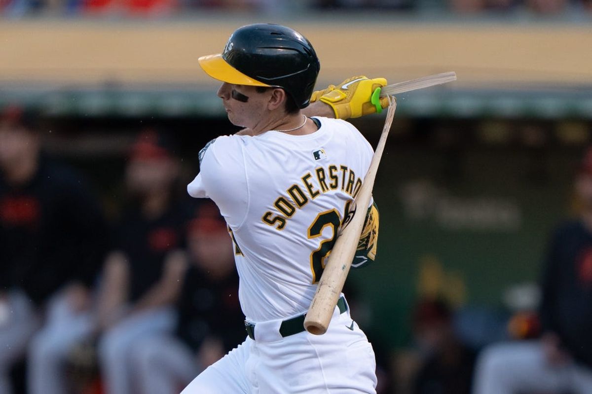 Jul 5, 2024; Oakland, California, USA;  Oakland Athletics first base Tyler Soderstrom (21) breaks his bat during the first inning against the Baltimore Orioles at Oakland-Alameda County Coliseum. Mandatory Credit: Stan Szeto-USA TODAY Sports