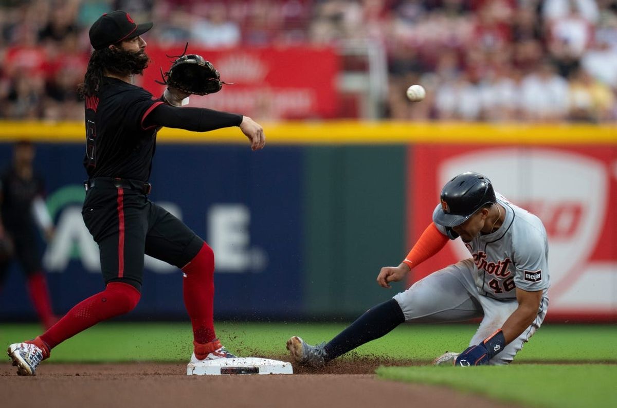 Cincinnati Reds second baseman Jonathan India (6) attempts to turn a double play as Detroit Tigers outfielder Wenceel Perez (46) slides into second in the fourth inning of the MLB game between the Cincinnati Reds and the Detroit Tigers at Great American Ball Park in Cincinnati on Friday, July 5, 2024.