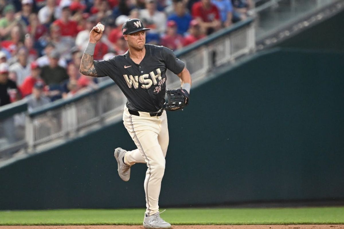 Jul 5, 2024; Washington, District of Columbia, USA; Washington Nationals third baseman Nick Senzel (13) looks to throw to first base after fielding a ground ball against the St. Louis Cardinals during the sixth inning at Nationals Park. Mandatory Credit: Rafael Suanes-USA TODAY Sports