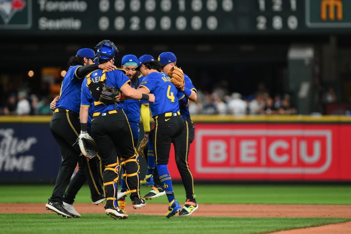 Jul 5, 2024; Seattle, Washington, USA; The Seattle Mariners celebrate defeating the Toronto Blue Jays at T-Mobile Park. Mandatory Credit: Steven Bisig-USA TODAY Sports